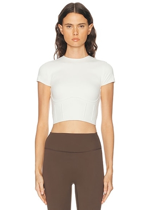 NikeSKIMS Matte Corset Short Sleeve Crop Top in Ivory - Ivory. Size S (also in XS, M, L, XL).