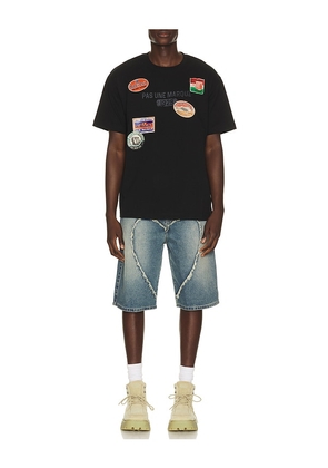 Pas Une Marque Luggage Tag Pas Tee in Black. Size L. Also in M, S, XL/1X.