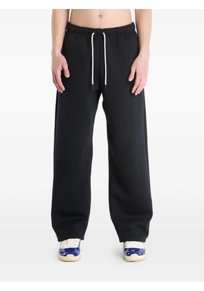 Nike Standard Issue open-hem track pants - Black