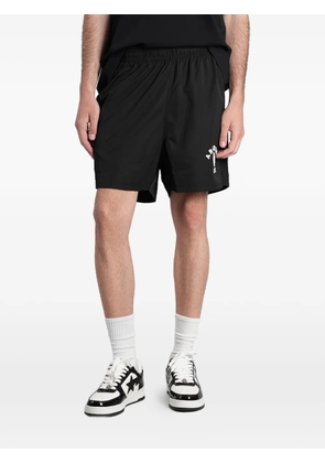 A BATHING APE® Ape Head logo-print track shorts - Black