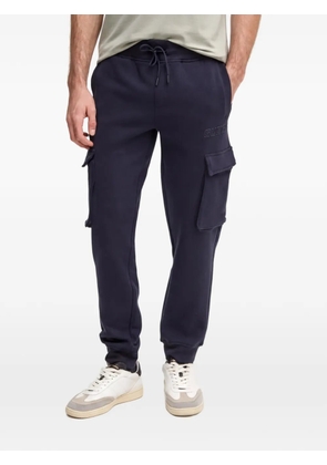 GUESS USA logo-patch drawstring track pants - Blue