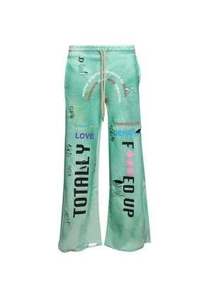 astrum distressed graphic-print track pants - Green