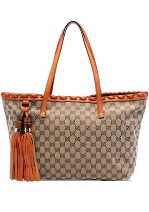 Gucci Pre-Owned 2016-2026 Medium GG Canvas Bamboo Tassel tote bag - Orange
