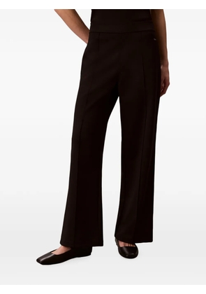 Calvin Klein logo-plaque wide-leg trousers - Brown