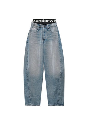 Alexander Wang logo-waistband layered-effect tapered jeans - Blue