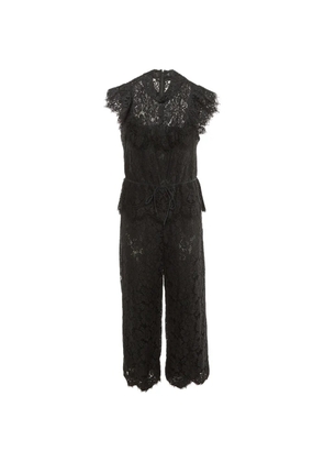 GANNI ruffle-trim lace jumpsuit - Black