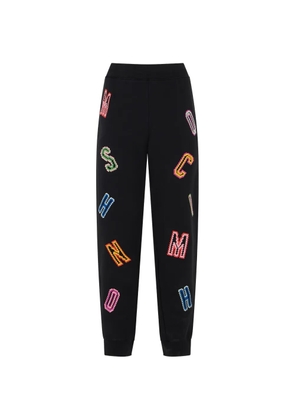 Moschino embroidered logo-patch track pants - Black