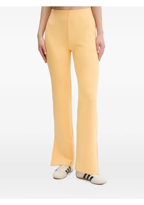 adidas Soft Lux flared trousers - Orange