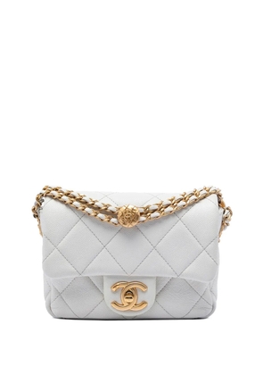 CHANEL Pre-Owned 2021-2026 Mini Quilted Caviar Twist Your Buttons Flap crossbody bag - White