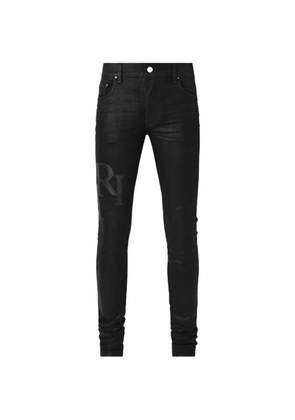AMIRI waxed staggered logo jeans - Black