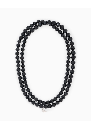 Double-strand necklace with faceted beads and a metal charm