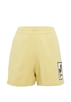 Moncler palm-appliqué shorts - Yellow