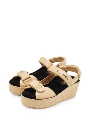 CHANEL Pre-Owned CC quilted wedge sandals - Neutrals