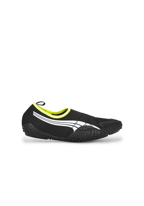 Puma Select Mostro Flex Sneaker in Black,Green. Size M13. Also in M6 / W7.5, M6.5 / W8, M7 / W8.5, M7.5 / W9, M8.5 / W10, M9 / W10.5, M9.5 / W11, M10