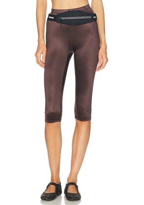 NikeSKIMS Shine Drawcord 17 Crop Tight in Phoenix - Chocolate. Size S (also in XS, M, L, XL).
