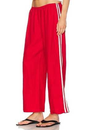 DONNI. The Linen Crop Racer Stripe Pant in Bell Pepper - Red. Size S (also in L, M, XL, XS).