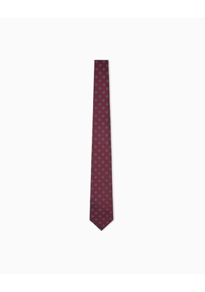 Silk tie with a pattern of dots in a diamond formation