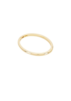 BaubleBar Gold Bangle in Metallic Gold.