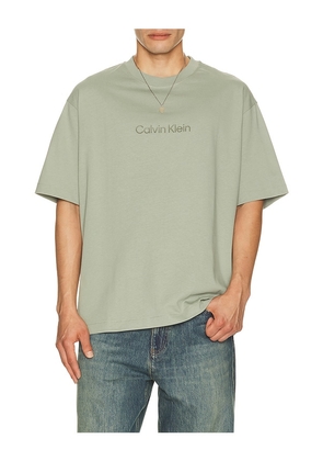 Calvin Klein Relaxed Standard Logo Crew Neck Tee in Green. Size XS. Also in S, M, L, XL/1X.