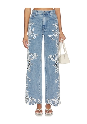 SIMKHAI Porter Embroidered Denim Pant in Blue. Size 24. Also in 25, 26, 27, 28, 29, 30.