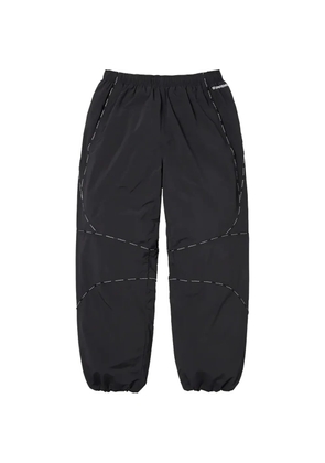 Supreme logo-piping track pants - Black