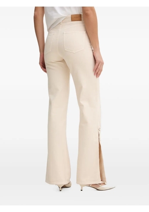 TWINSET eyelet-embellished slit-hem jeans - Neutrals