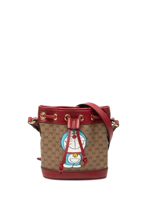 Gucci Pre-Owned 2016-2026 Micro GG Supreme Doraemon bucket bag - Neutrals
