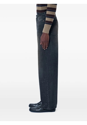 ssstein Wide-leg denim jeans with five-pocket construction.Mid riseButton and zip-fly fasteningBelt loopsFive pocketsFaded effect - Black