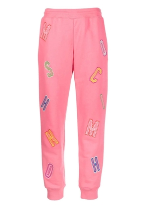 Moschino logo-lettering track pants - Pink