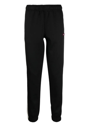 Diesel logo-patch tapered track pants - Black
