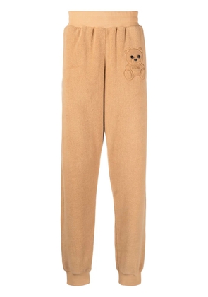 Moschino embroidered-teddy fleece track pants - Brown