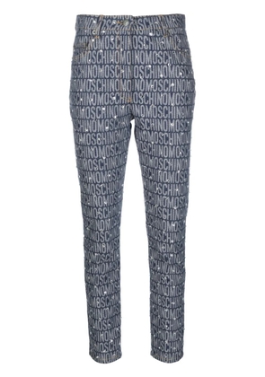 Moschino monogram-print skinny jeans - Blue