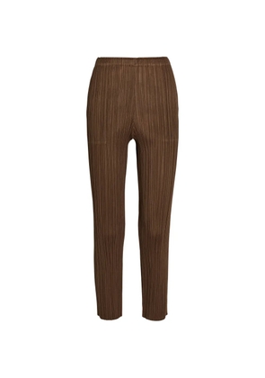 Issey Miyake pleated-texture trousers - Brown