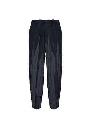 Issey Miyake Men Edge pleated panelled-detail trousers - Black