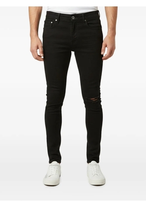 AMIRI distressed skinny jeans - Black