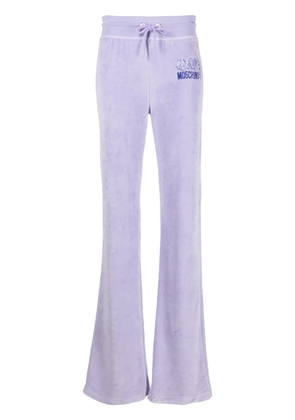 Moschino logo-print velour track pants - 1277 - Blu