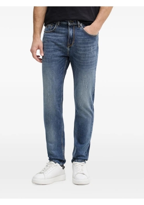 Karl Lagerfeld distressed logo-patch jeans - Blue