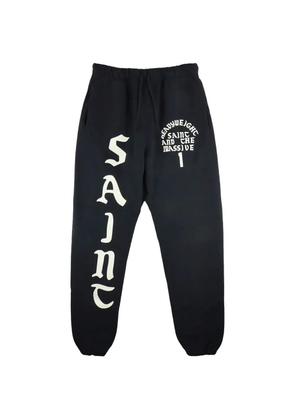 SAINT MXXXXXX It's Saint logo-print track pants - Black