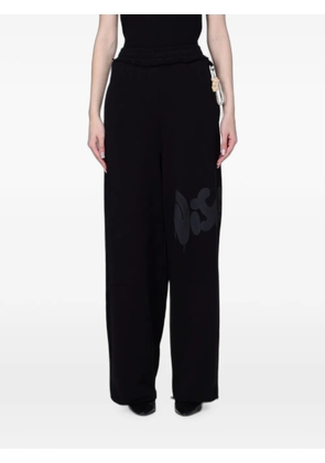 DISCLAIMER logo-print wide-leg track pants - Black