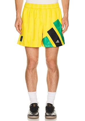Adidas Originals x Brain Dead x Disney Football Short in Bold Gold - Yellow. Size XL/1X (also in XS, S, M, XXL/2X).