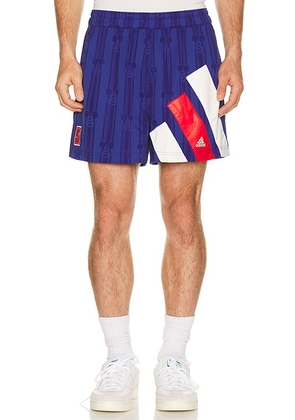 Adidas Originals x Brain Dead x Disney Football Short in Victory Blue - Blue. Size XS (also in S, M, XXL/2X).