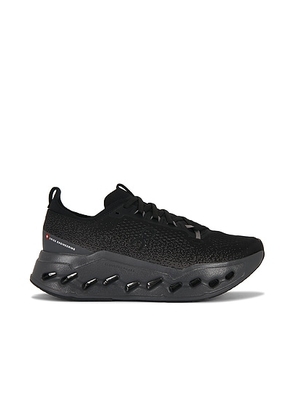 On Cloudsurfer Max in Black & Eclipse - Black. Size 11.5 (also in 7, 7.5, 8, 8.5, 9, 9.5, 10, 10.5, 11, 12, 13).