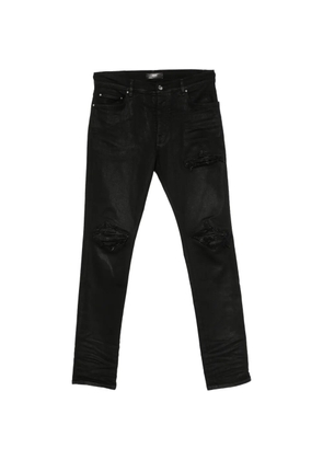 AMIRI distressed-effect coated jeans - Black