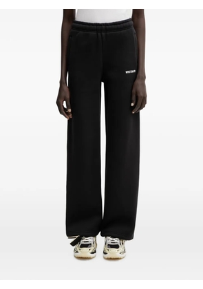 WRSTBHVR Naima logo-print track pants - Black