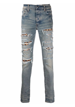 AMIRI ripped-detail jeans - Blue