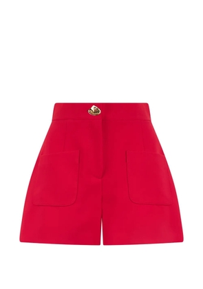 Moschino logo-button patch-pocket shorts - Red