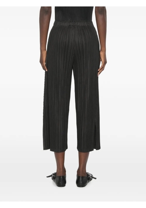 Pleats Please Issey Miyake plissed-effect trousers - Black