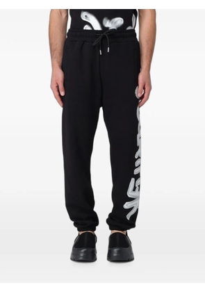 DISCLAIMER logo-print drawstring track pants - Black