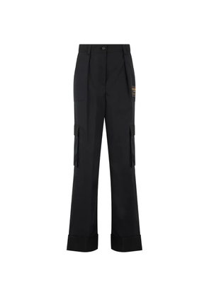 Moschino logo-patch cargo-pockets flared trousers - Black