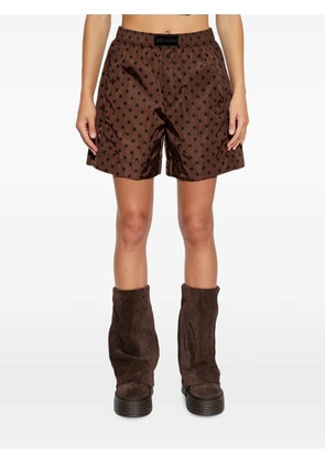 GANNI polka-dot logo-patch shorts - Brown